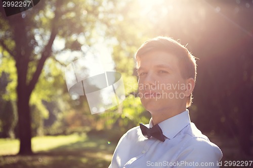 Image of Elegant young handsome groom. Fashion portrait.