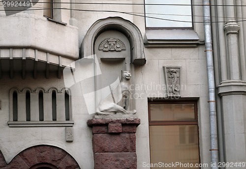 Image of Sculpture of a cat on a historic building