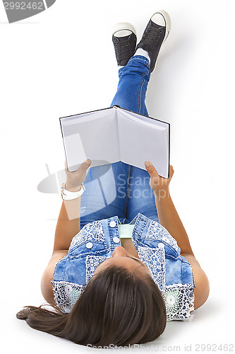 Image of teenager girl reading book isolated over white background