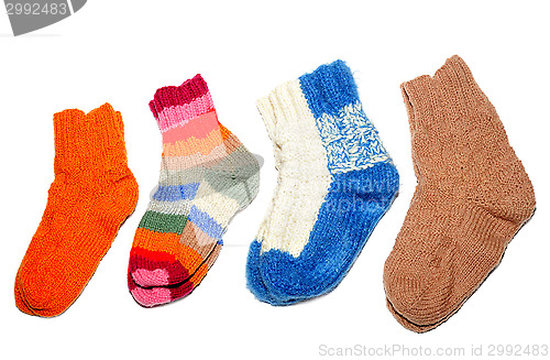 Image of Warm knitted woolen socks knitting needles isolated on a white background