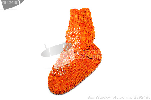 Image of Warm knitted woolen sock knitting needles isolated on a white background