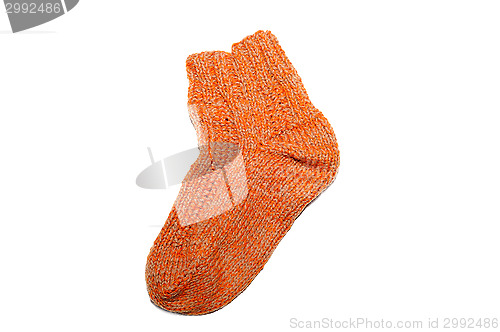 Image of Warm knitted woolen sock knitting needles isolated on a white background