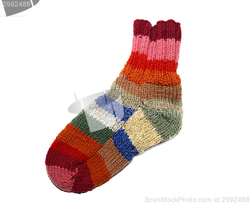 Image of Warm knitted woolen sock knitting needles isolated on a white background
