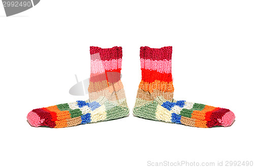 Image of Warm knitted woolen socks knitting needles isolated on a white background