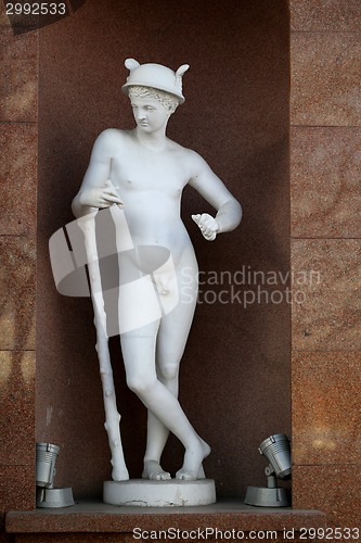 Image of statue of a naked man on a historic