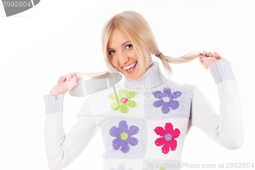 Image of Pretty woman with hands in hair