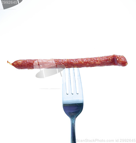Image of sausage on a fork
