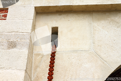 Image of rusty chain on old castle entrance