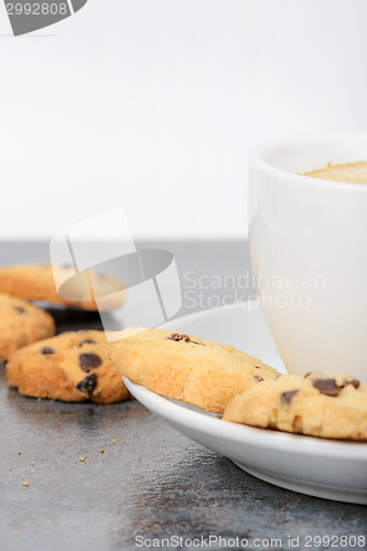 Image of Half cup of coffee with cookies on the table