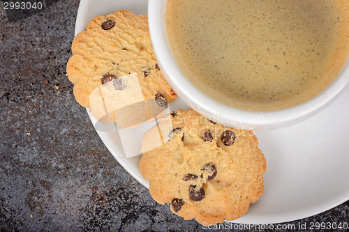 Image of Cup of coffee americano with cookies on table
