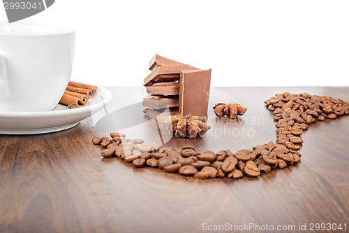 Image of Mug, coffee beans, chocolate and anise