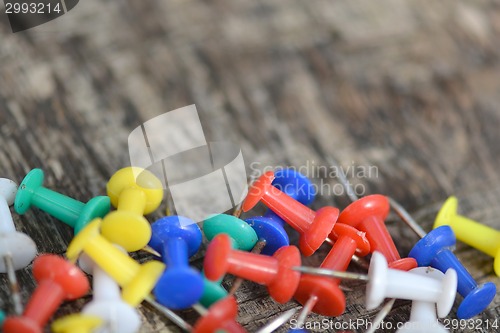 Image of Set of old pins on wood background