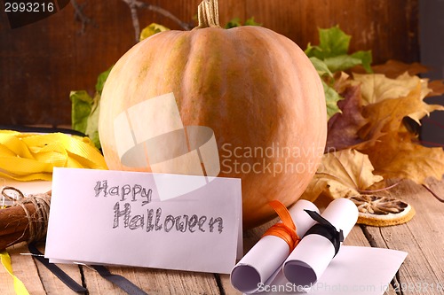 Image of pumpkin on wooden table, happy halloween concept