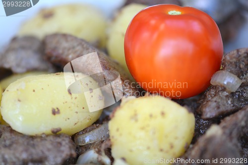 Image of Fried pork liver with tomatoes and potatoes