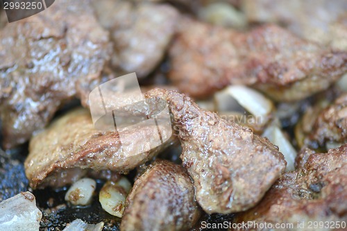 Image of fresh ripe roasted beef meat with onion