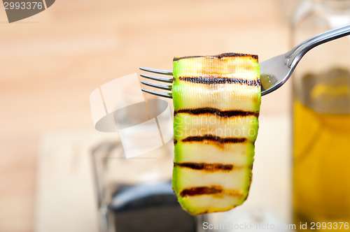 Image of grilled zucchini courgette on a fork