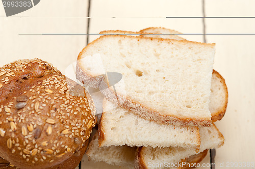 Image of organic bread over rustic table