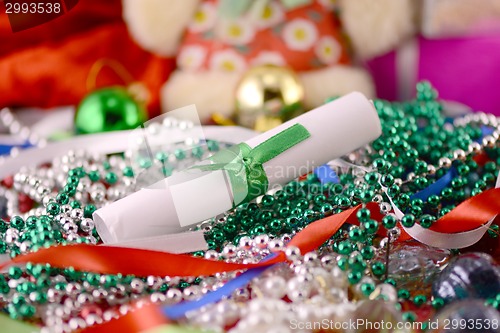 Image of christmas ornament with pearls and white paper, new year card