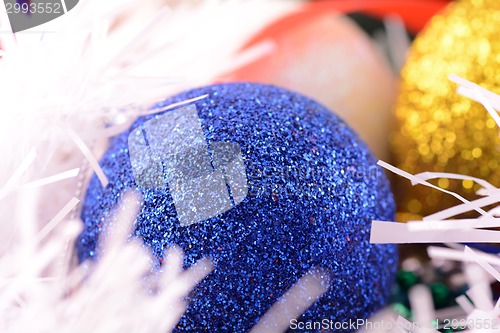 Image of blue and yellow Christmas balls close up