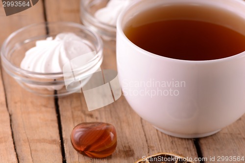 Image of A cup of tea on wooden background