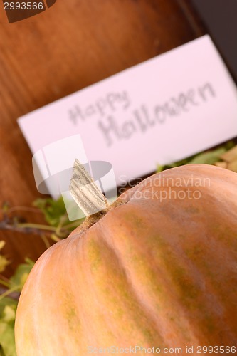 Image of pumpkin on wooden table, happy halloween concept