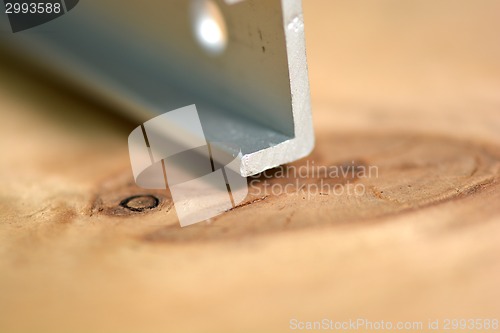 Image of close up metal details on wooden background