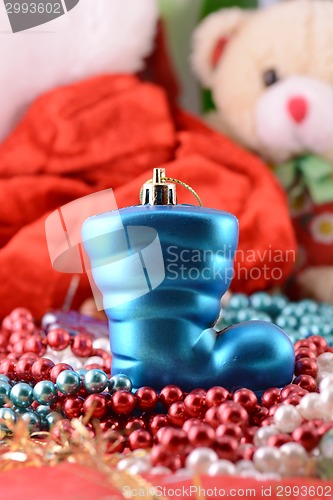 Image of blue christmas boot with gifts, new year holiday