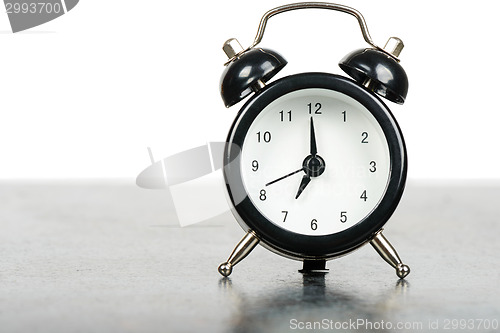 Image of Black alarm clock on the table