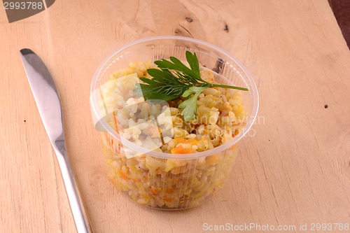 Image of Chinese cuisine - fried rice with meat on wooden background