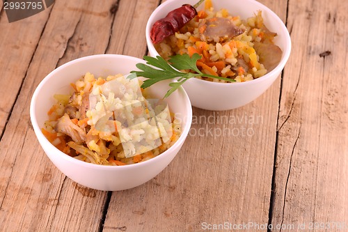 Image of Chinese rice in a bowl on a wooden table