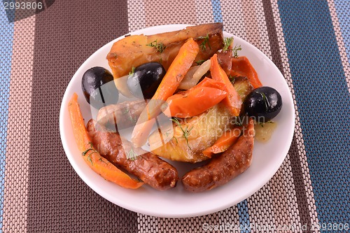 Image of fresh salad with olives sausage carrot