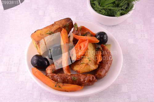 Image of Fresh tasty salad served with carrots and green salad leaf