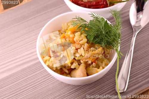 Image of Chinese rice in a bowl on a wooden table