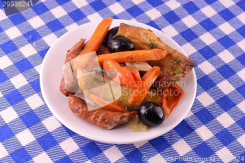 Image of fresh salad with olives sausage carrot