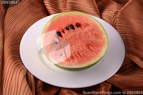 Image of Watermelon fruit sliced pieces on the white plate