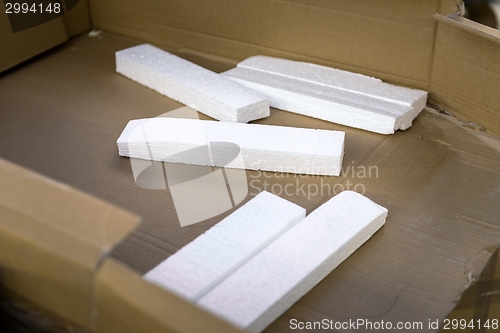 Image of Opened cardboard box in a building