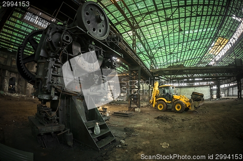 Image of Industrial interior with bulldozer inside