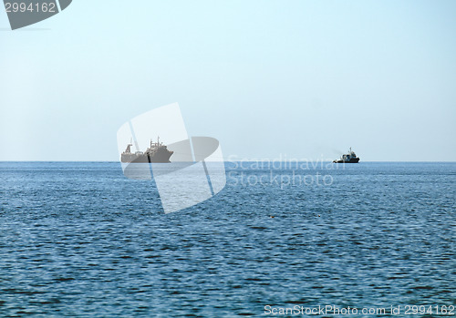 Image of Warship sailing in still water