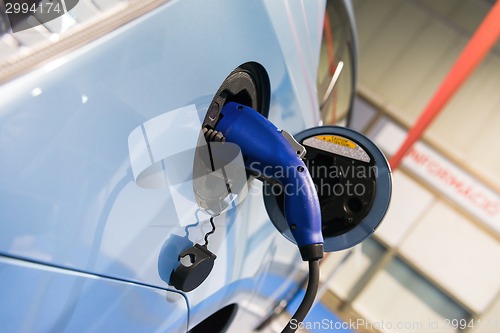 Image of Electric Car Being Charged at the station