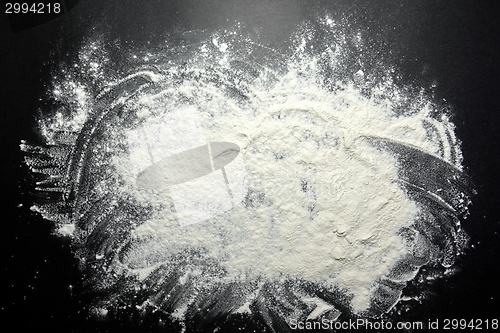 Image of White flour on black background