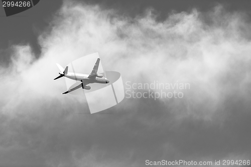 Image of Tranquil sky with airplane traveling