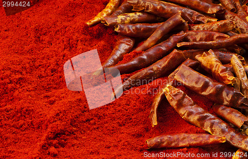 Image of Red chili peppers and chili powder