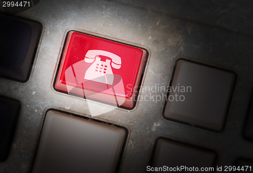 Image of Red button on a dirty old panel