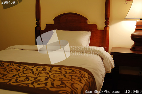 Image of Bed and table lamp