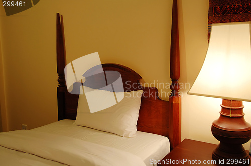 Image of Bed and table lamp