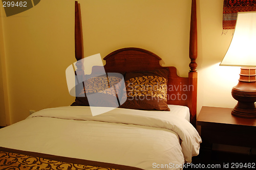 Image of Bed and table lamp