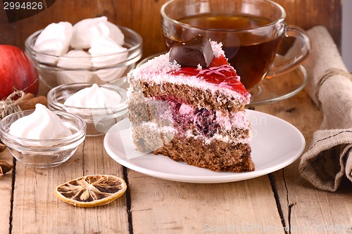 Image of Chocolate Cake with tea cup and meringues