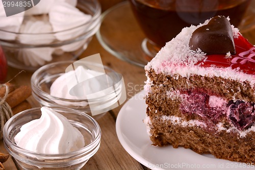 Image of Chocolate Cake with tea cup and meringues
