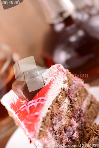 Image of Cake with chocolate heart and glass carafe