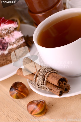 Image of cinnamon cake and tea with sweet chocolate cake